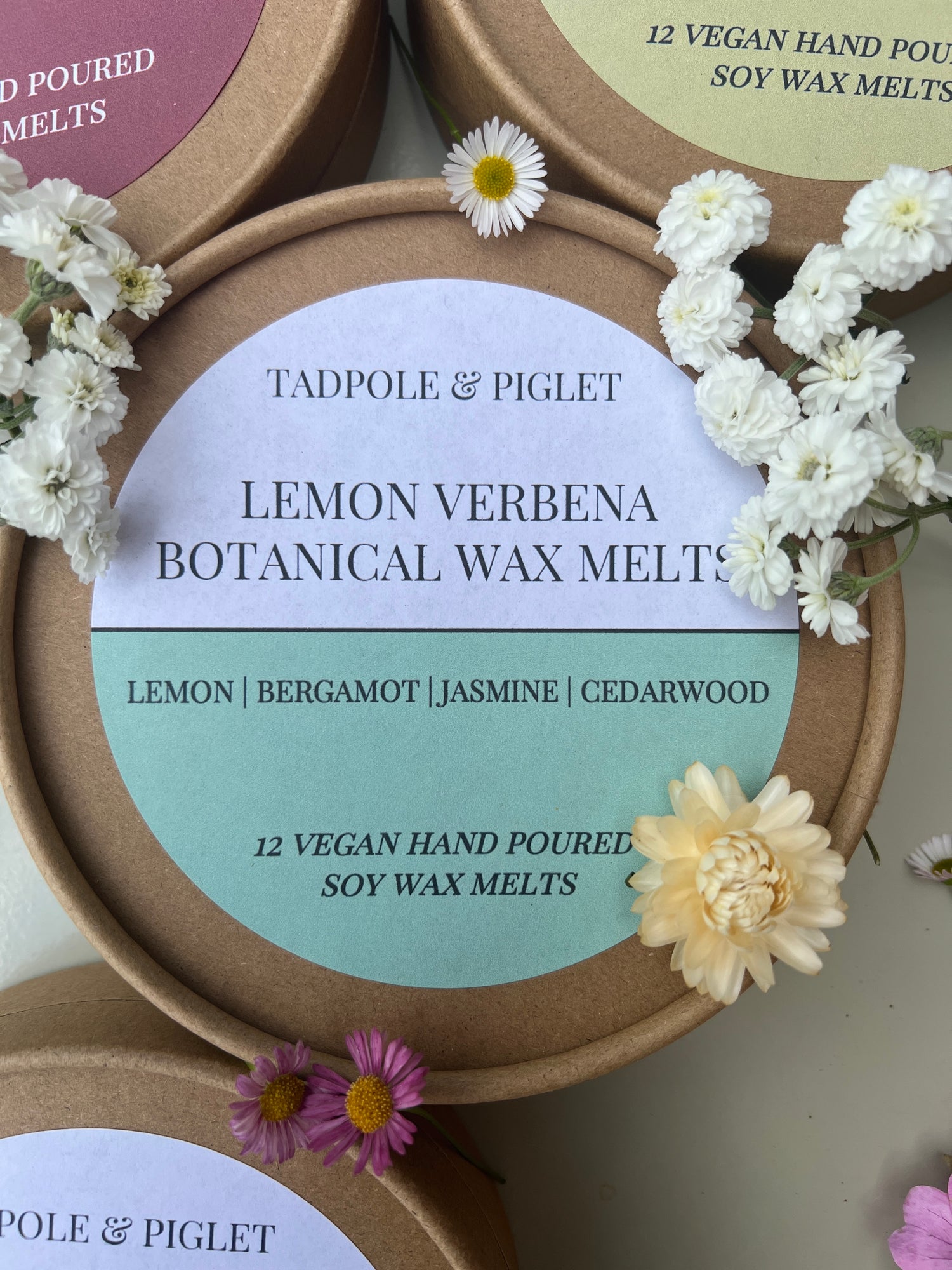 Lemon Verbena Botanical Wax Melts label surrounded by flowers, showcasing vegan hand-poured soy wax melts.