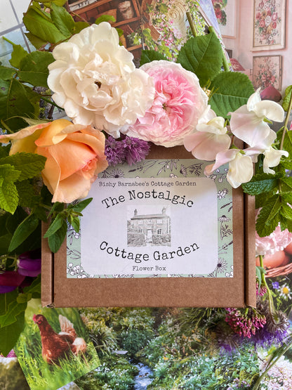 The Nostalgic Cottage Garden Flower Box surrounded by vibrant roses and foliage